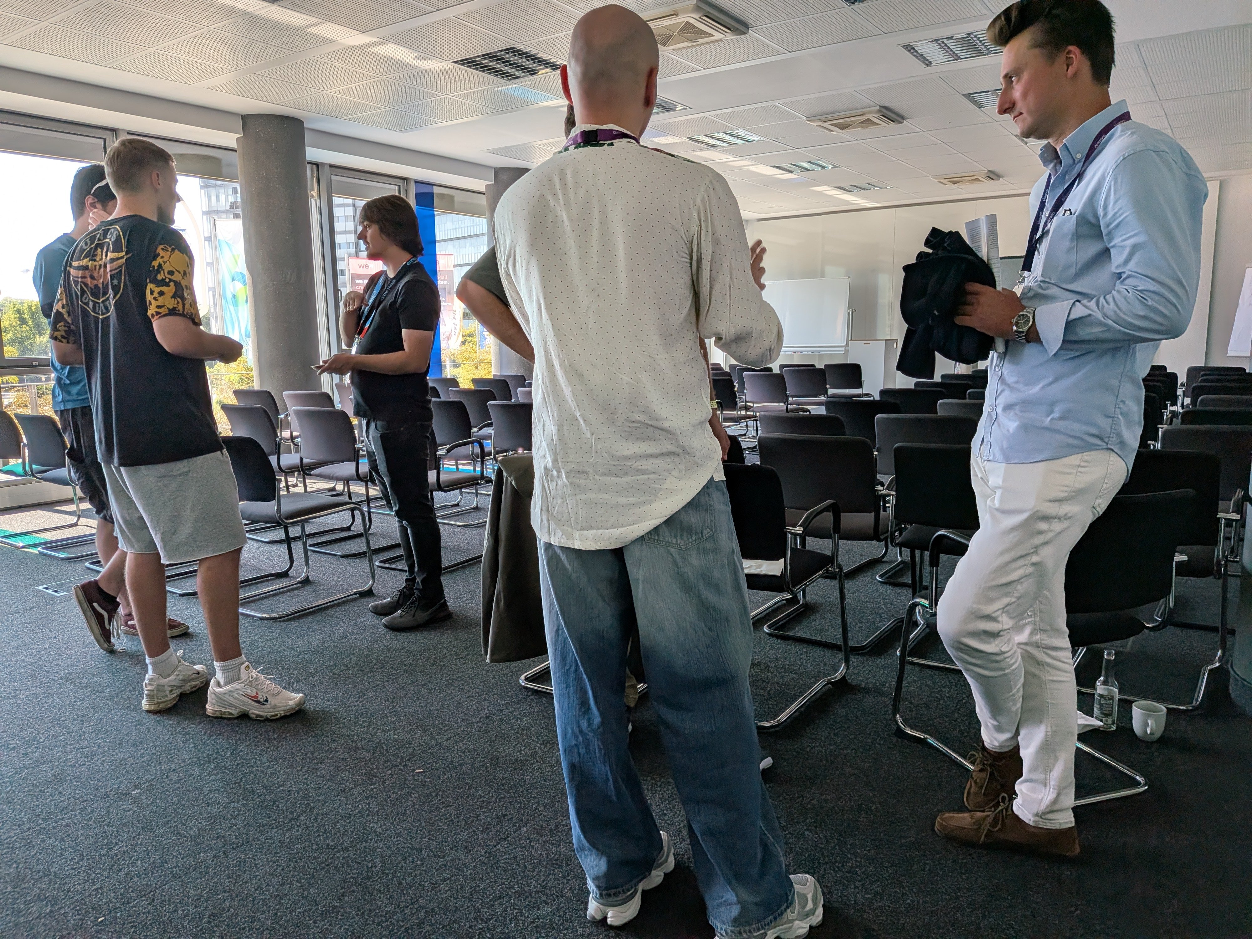 Attendees networking between sessions at The Agent AI Summit, Gamescom Cologne